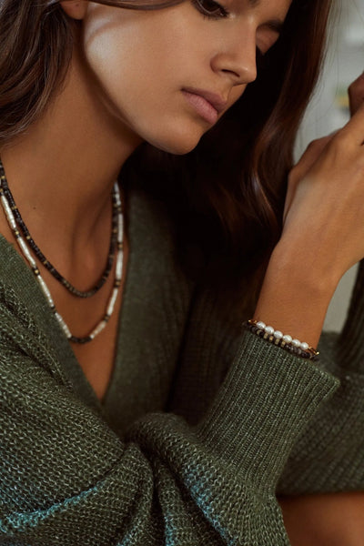 Anine Pearls Bracelet styled with layered gold jewellery - Sofia Godinho