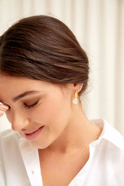 Model wearing Nugget Pearl Earrings – bold modern elegance